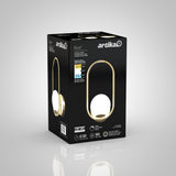 Black and gold box packaging for an Artika Bloom LED table lamp, featuring an image of the lamp with a glowing spherical bulb encased in a gold oval ring. Product specs and energy ratings are visible on the side.