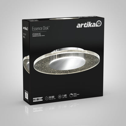 A black Artika-CAN-dev box showcases the Essence Disk LED flush mount: modern circular design, glass diffuser, chrome finish, and sparkles. Icons highlight 50,000 hours, 1,400 lumens brightness, and dimmable LED features.