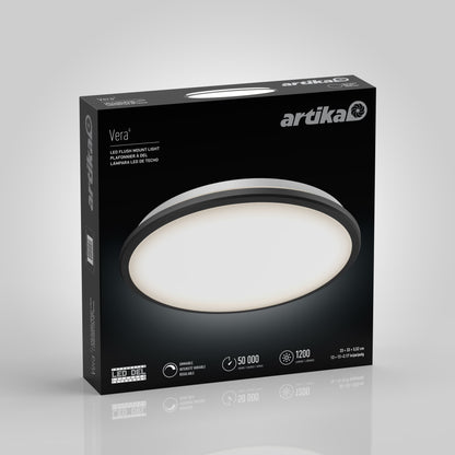 A box of Artika-CAN-dev Vera 13 in. LED modern flush mount light features a round matte black fixture. The packaging highlights 1200 lumens, a 50,000-hour lifespan, and LED dimmer compatibility for adjustable lighting.
