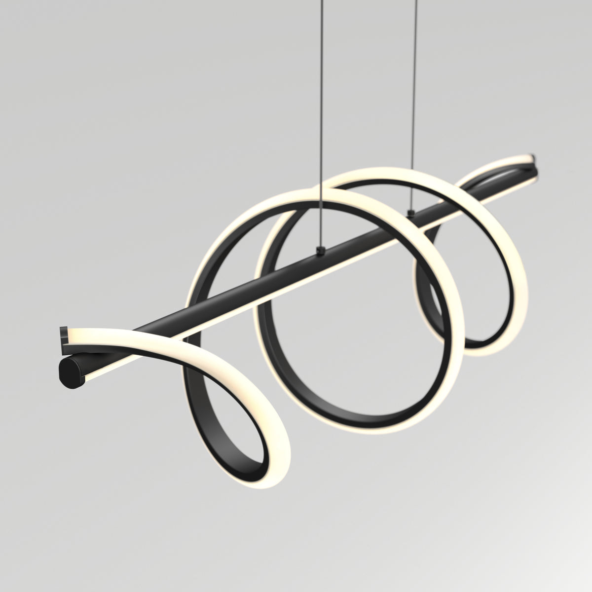 A modern, sculptural pendant light fixture with two glowing circular LED loops intertwined around a horizontal black rod, suspended by thin cables against a plain, light gray background.
