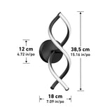 A modern wall light featuring a black and white twisted design, mounted on a round black base. Dimensions are 38.5 cm high, 18 cm wide, and 12 cm deep, with inch equivalents shown beside each measurement.