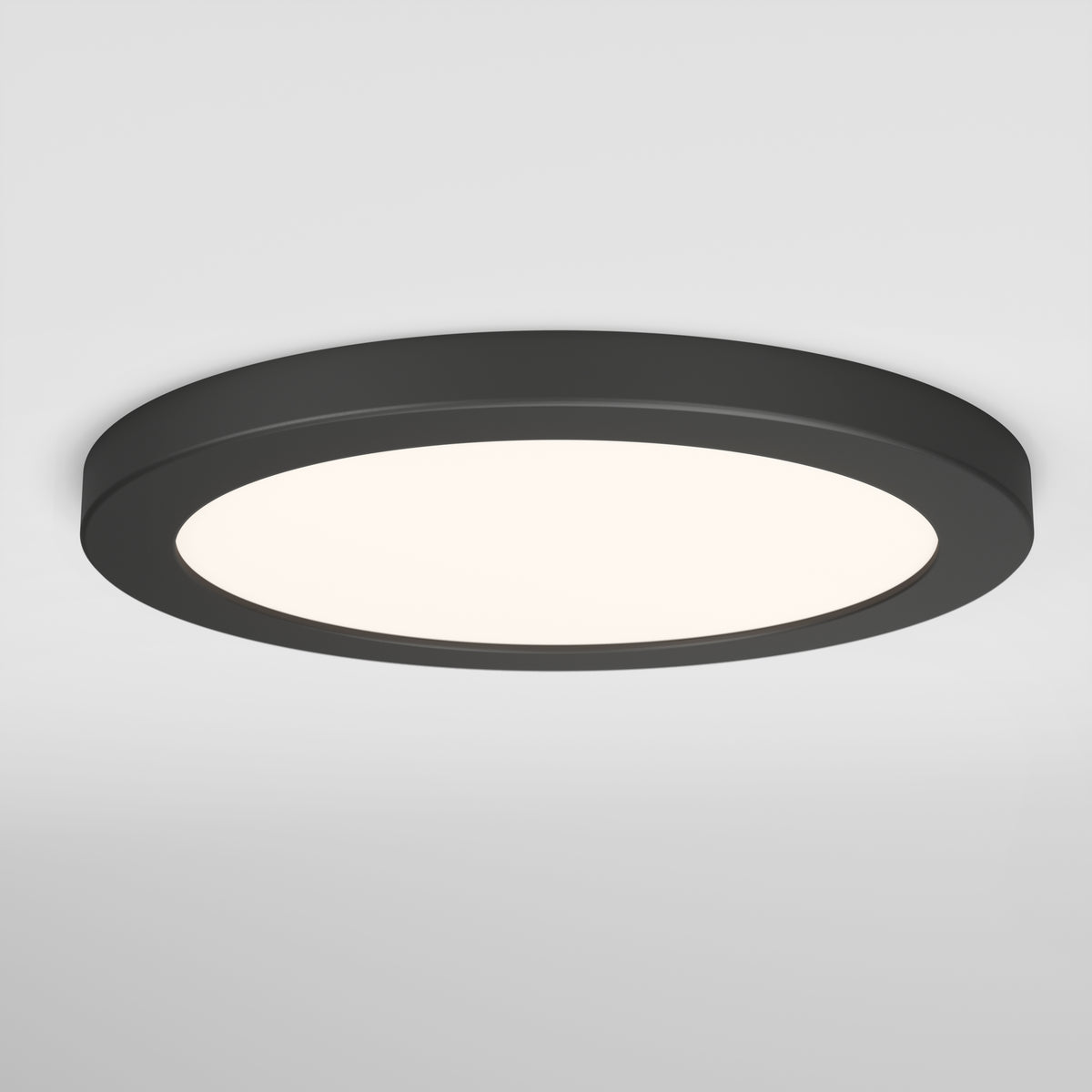 A round, modern black ceiling light fixture with a smooth frame and a diffused white light, mounted on a white ceiling.