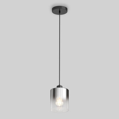 The Artika Haze pendant light features a clear cylindrical glass shade, visible bulb, and black cord with ceiling mount, shown against a plain gray background.