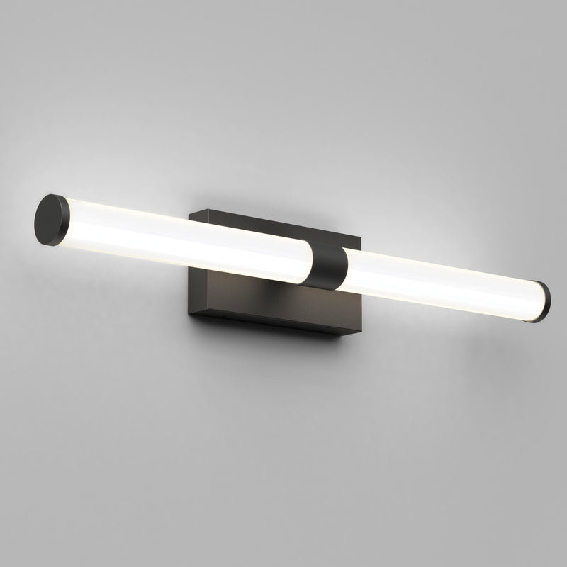 The Artika Vitoro modern LED bathroom vanity light features a sleek horizontal cylinder design and black rectangular base, ideal as an industrial wall sconce for modern home lighting against a plain gray wall.