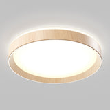 A modern, circular ceiling light with a wooden rim and a bright white diffuser, mounted on a plain light gray ceiling.