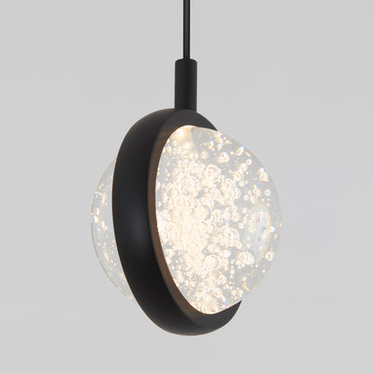 Artikas Avalon LED 1-light pendant features a spherical glass shade with air bubbles, a matte black metal band, and hangs from a black cord against a plain light gray background.