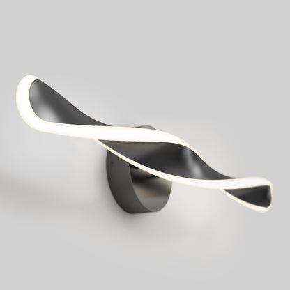 The Artika Finley LED modern bathroom vanity light 3 CCT features a sleek, twisted black-and-white design and emits soft edge lighting, shown wall-mounted against a plain gray background.