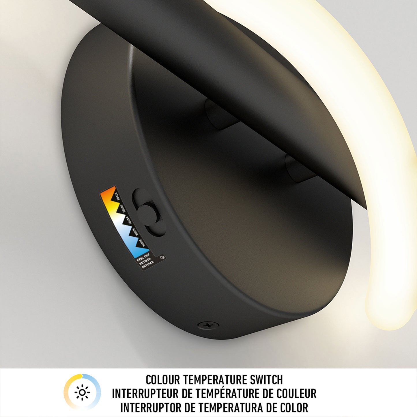 Close-up of the Artika Neon modern LED bathroom vanity light 5 CCT, featuring a curved glowing LED strip. The base includes a small switch and a colorful indicator with COLOUR TEMPERATURE SWITCH text in three languages.