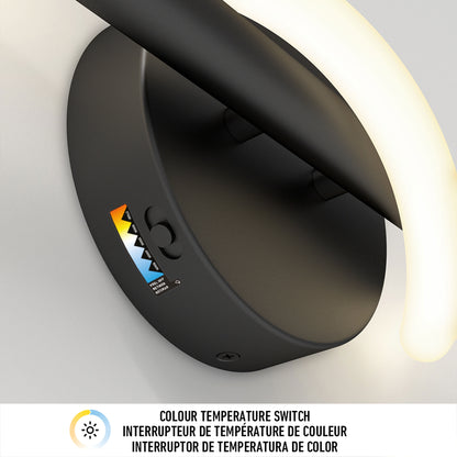 Close-up of the Artika Neon modern LED bathroom vanity light 5 CCT, featuring a curved glowing LED strip. The base includes a small switch and a colorful indicator with COLOUR TEMPERATURE SWITCH text in three languages.