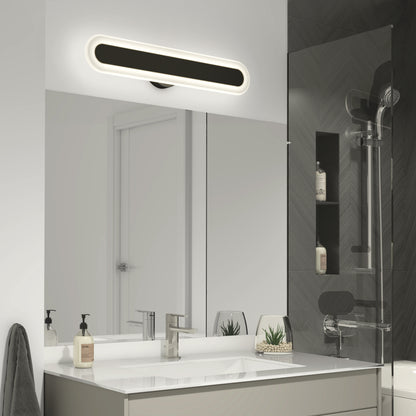 Modern bathroom featuring a rectangular mirror, sleek sink, soap dispensers, potted succulents, and the Artika Pista modern LED bathroom vanity light 5 CCT above the mirror. On the right is a glass shower with dark tiles.