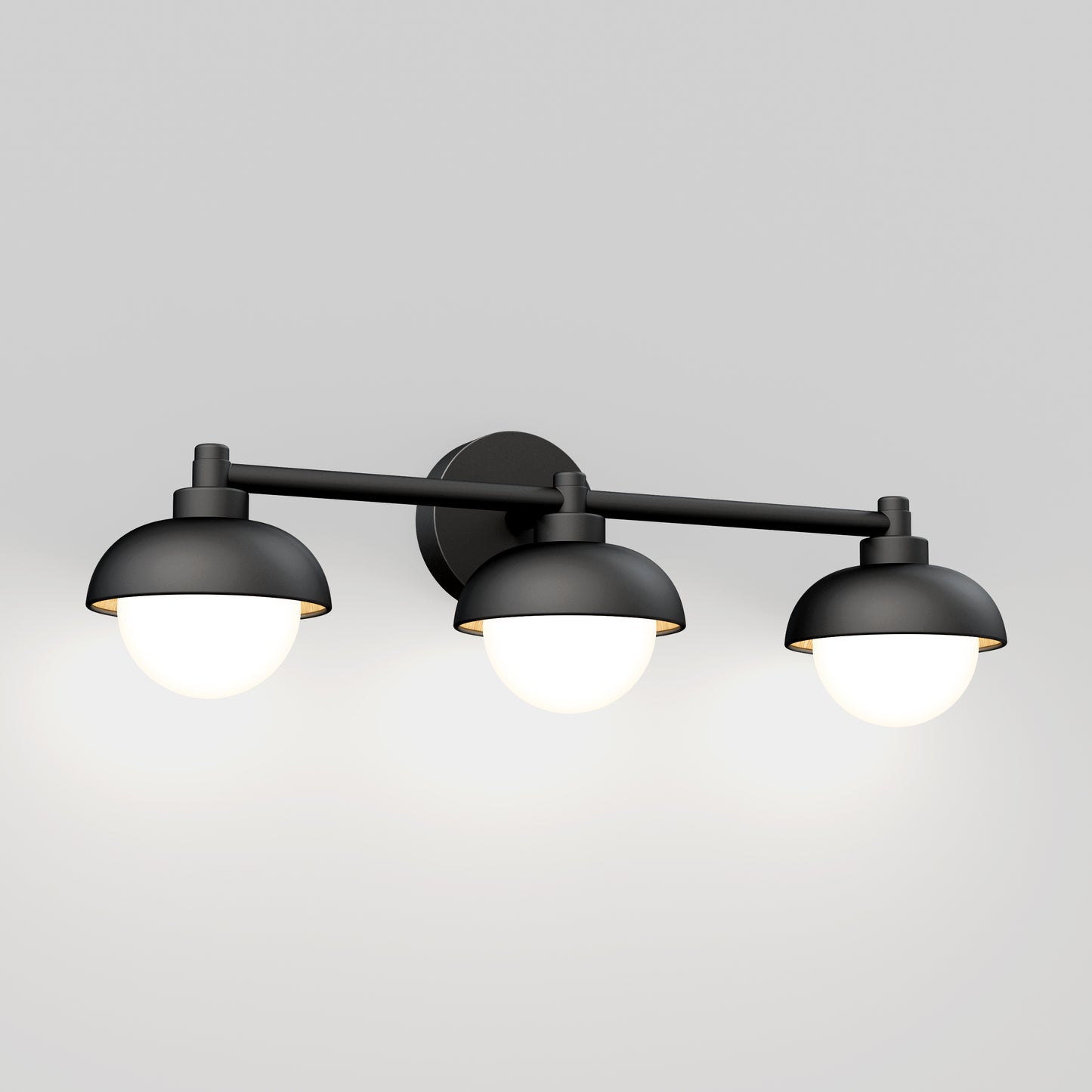 The Artika Boden LED mid-century bathroom vanity light 5 CCT is a modern black wall-mounted fixture with three dome-shaped shades, each featuring a round glowing bulb, shown against a plain light gray background.