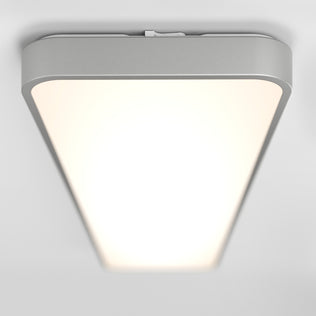 The Artika Europa 48 LED flush mount light features a modern triangular design with a frosted white cover, metallic silver frame, and comes with a remote for easy control.