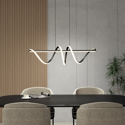 A modern dining room with a black table, four upholstered chairs, a cup and paper on the table, wood paneling, concrete walls, a potted plant in the corner, and the Artika Coda modern LED pendant light 5 CCT hanging above.