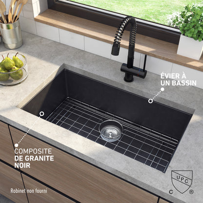 Artika Baycrest 33″ black single-bowl sink in a modern kitchen with wire grid and black faucet.