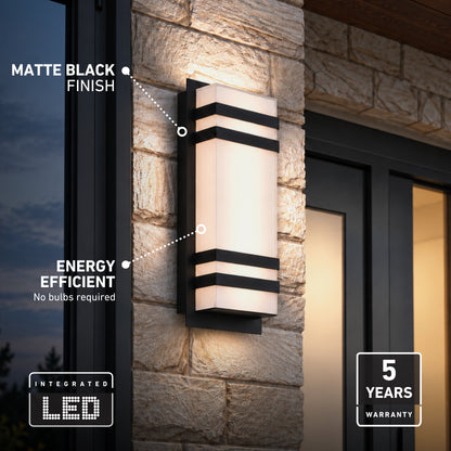 Matte black Glowbox 3 indoor-outdoor LED wall light on a stone exterior, featuring energy-efficient, bulb-free lighting with a 5-year warranty.