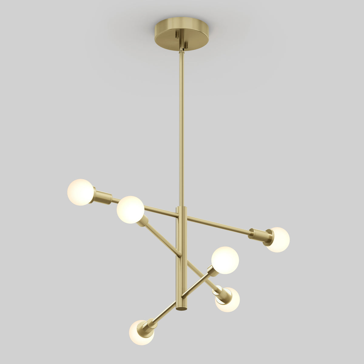 A modern gold chandelier with six white globe bulbs, arranged asymmetrically on metal rods and suspended from a ceiling mount against a light gray background.
