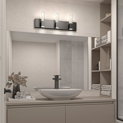 Modern bathroom with a rectangular mirror, vessel sink, and black faucet. Open shelving holds towels and toiletries. Above the mirror is the Artika Hologram LED modern bathroom vanity light 5 CCT. Neutral colors create a clean, organized look.