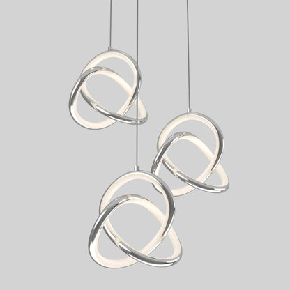 The Artika Zephyr 3-light LED pendant features intertwined metallic and glowing white loops, suspended from the ceiling against a plain gray background.