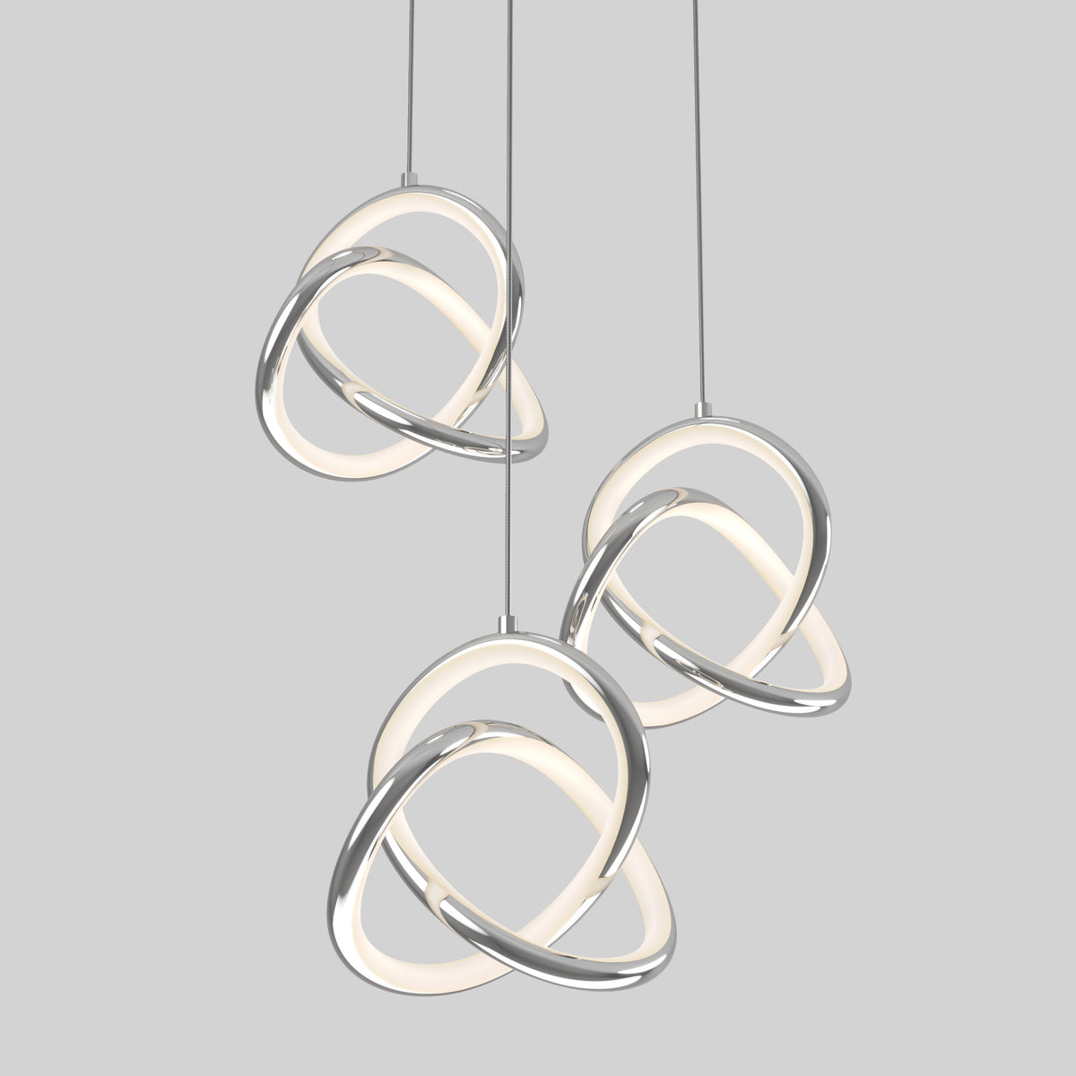 Three modern pendant lights with intertwined chrome and glowing white loops hang against a plain light gray background.