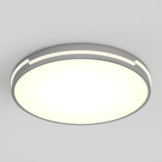 The Artika Delray 15.7 in. LED modern flush mount light features a white illuminated center, a silver-gray rim, and 5 selectable color temperatures, mounted on a plain light-gray ceiling.