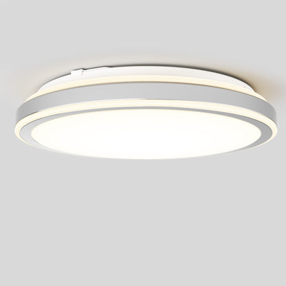 The Artika Altitude 15 in. LED modern flush mount light features two thin outer rings, a bright central light, and a white and silver finish, installed on a plain light gray ceiling.