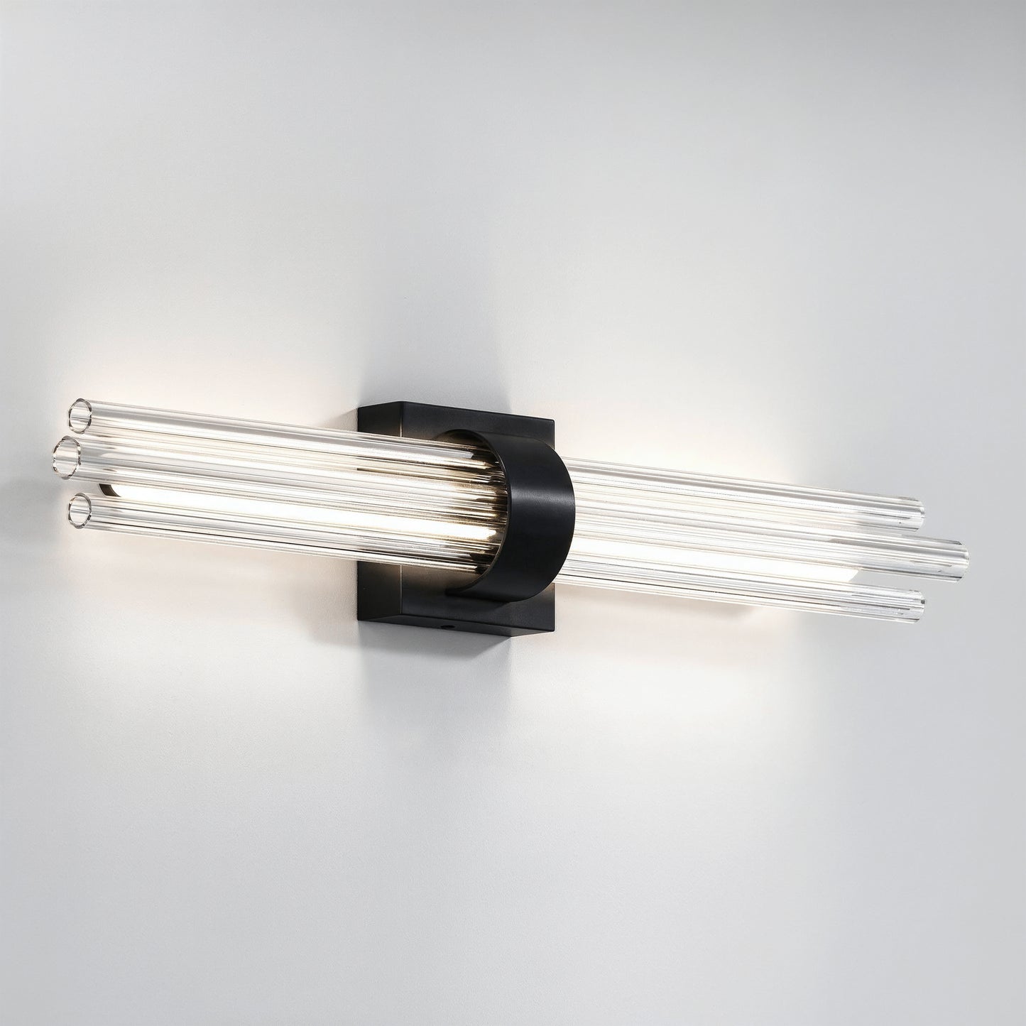 Artika Dorado 27 in. LED wall vanity features clear glass rods and black base for stylish bathroom lighting on a white wall.