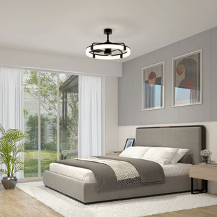 Modern bedroom with a large bed, gray and white bedding, two abstract art pieces above the headboard, an Artika Sunnyvale 28 in. LED modern ceiling fan with remote, potted plant, nightstands, and sliding glass door to a garden patio.