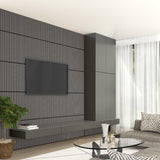 Modern living room with a wall-mounted flat screen TV on a dark striped accent wall, floating shelves, a glass coffee table, gray sofa, indoor plant, and sheer white curtains letting in natural light.