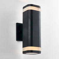 The Artika Mettle LED indoor-outdoor wall light features a modern black design with rounded edges and two frosted bands that emit soft light, shown mounted on a white wall.