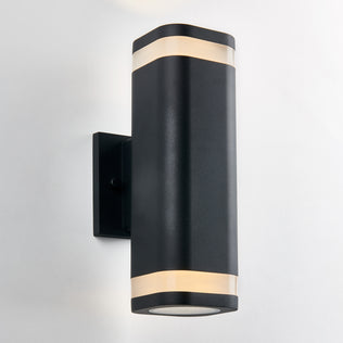 The Artika Mettle LED indoor-outdoor wall light features a modern black design with rounded edges and two frosted bands that emit soft light, shown mounted on a white wall.