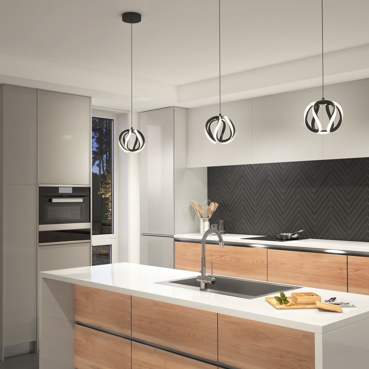 Modern kitchen with wood and white cabinetry, black herringbone backsplash, and three decorative pendant lights over a white island with a sink. A cutting board and utensils are on the counter.