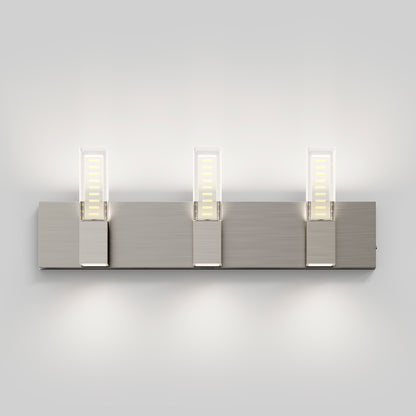 The Artika Hologram LED modern bathroom vanity light 5 CCT features three rectangular LED lights on a brushed metal base, offering upward and downward soft illumination against a light gray wall.