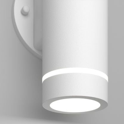 A close-up of the Artika C7 indoor-outdoor LED wall light 3 CCT, a modern cylindrical white fixture featuring a glowing ring near the top and a bright circular bottom light, mounted on a round wall plate.