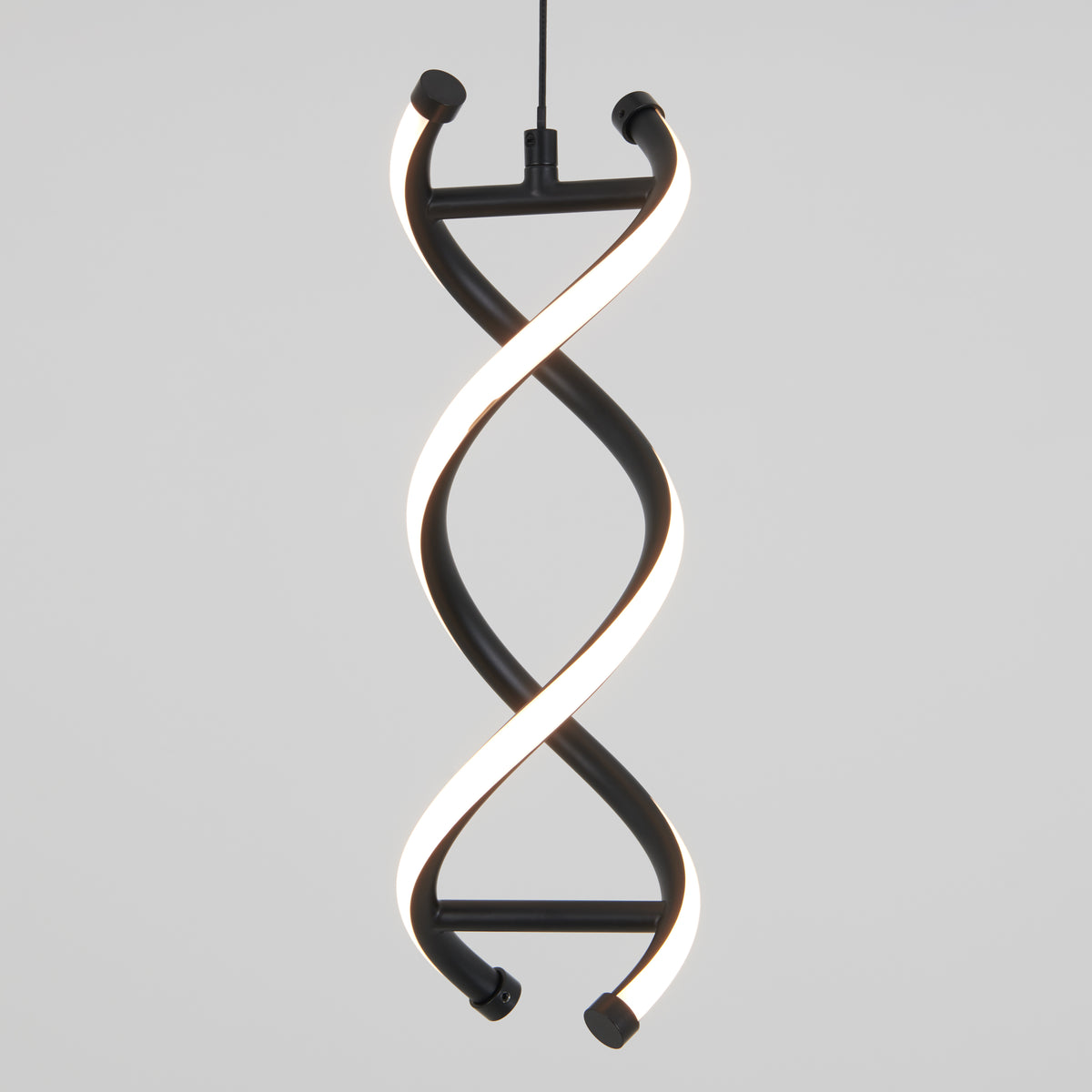 The Artika DNA LED pendant light features two twisted, glowing LED strips in a double helix design, elegantly suspended from the ceiling against a plain white background.