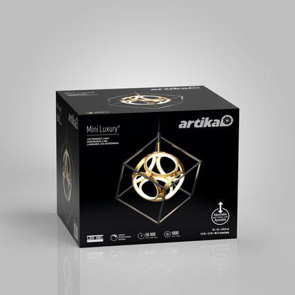 The Artika Mini Luxury LED pendant light comes in a black box displaying the modern geometric fixture, which features gold rings within a black cube frame, along with product details on the packaging.