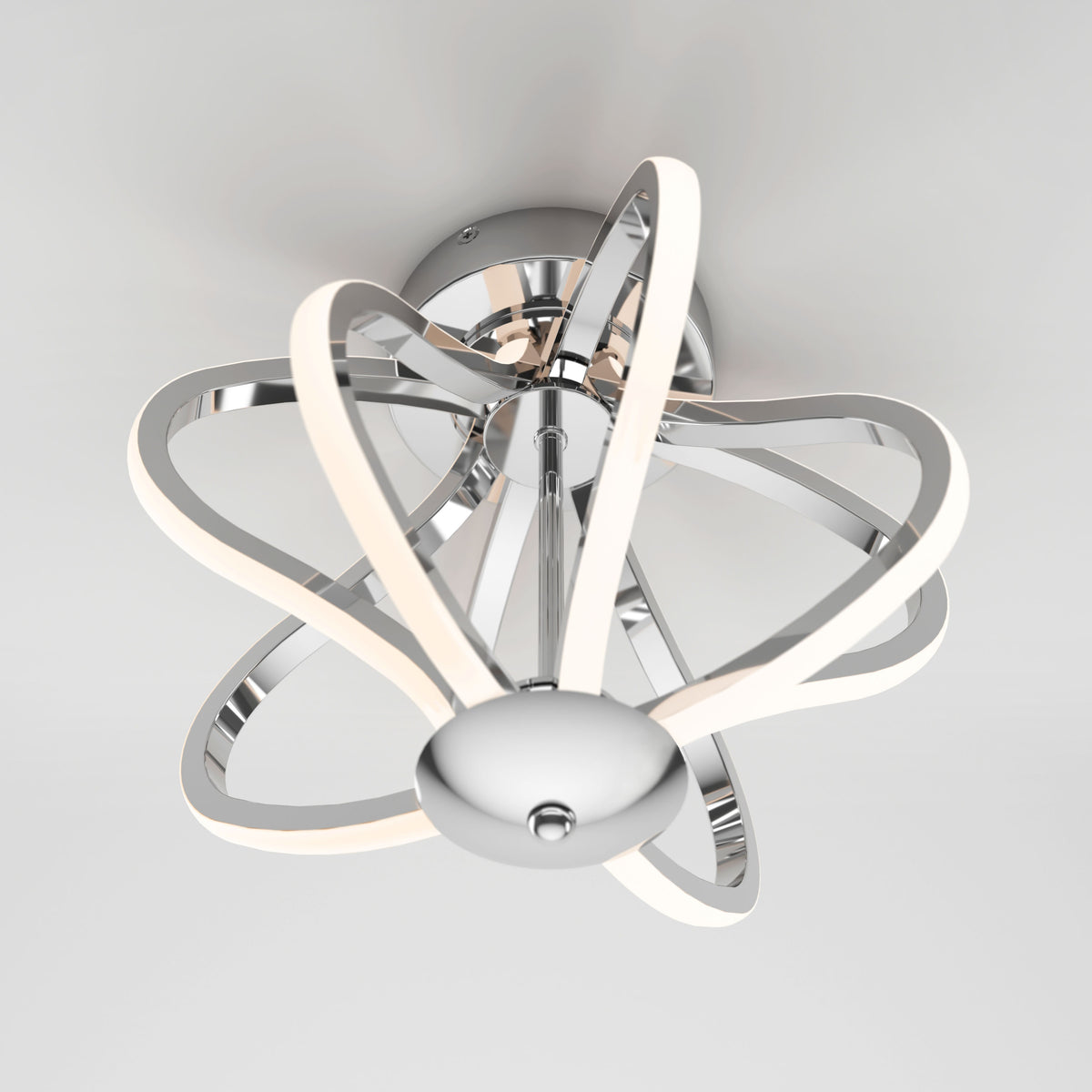 Modern ceiling light fixture with a polished chrome base and intertwined, glowing LED loops forming an abstract, sculptural design, mounted on a white ceiling.