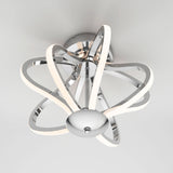 Modern ceiling light fixture with a polished chrome base and intertwined, glowing LED loops forming an abstract, sculptural design, mounted on a white ceiling.