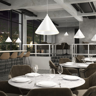 Modern restaurant with round marble tables, brown chairs, and Artika Denali modern LED pendant lights (3 CCT adjustable).