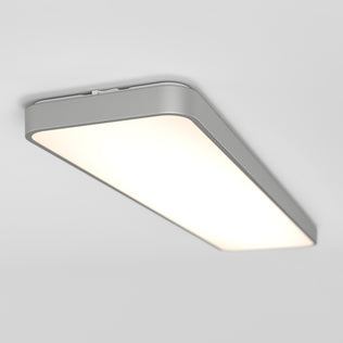 The Artika Europa 48 LED flush mount light, featuring a rectangular modern design with rounded edges, emits a soft white glow on a plain white ceiling and comes with a remote.