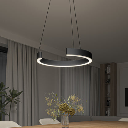 An Artika Vance modern LED pendant light (3 CCT) hangs over a wooden dining table with a glass vase of dried flowers. The room features beige curtains, a large window, and built-in shelves in the background.