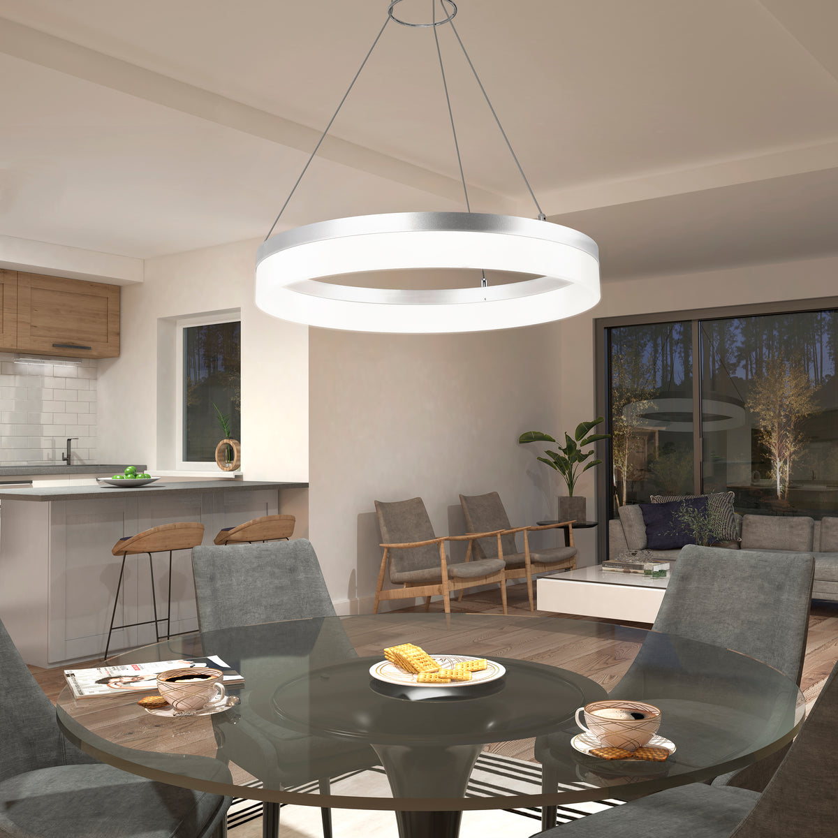 Modern dining area featuring a glass table set for breakfast, gray chairs, and the Artika Optical LED pendant light 3 CCT illuminating the space, with open views to a cozy living area and sunlit kitchen.