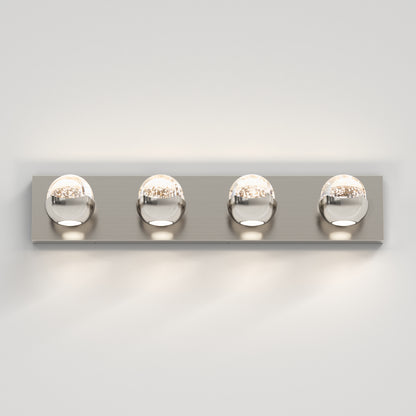 The Artika Oracle 4 light LED bathroom vanity light features four evenly spaced round bulbs on a sleek rectangular chrome base, perfect for mounting on a plain white wall.