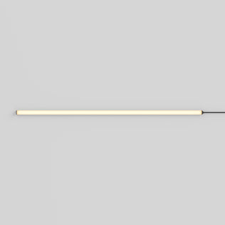 The Artika Lumilok LED Wall Panel Light for Sonolok casts a soft glow on a white wall, with a sleek remote and black power cord.