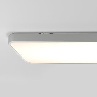 The Artika Europa 48 LED flush mount light features rounded edges and mounts to a white ceiling, emitting a soft, even glow. Includes remote for convenient control.