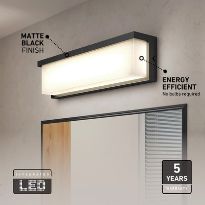 The Artika Bristol modern LED bathroom vanity light 3 CCT, in matte black, is mounted above a mirror in a contemporary bath. Energy-efficient and integrated LED with a 5-year warranty are highlighted in the display text.