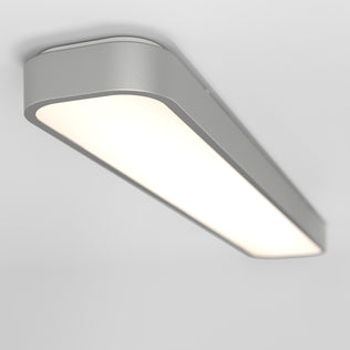 The Artika Europa 36 LED flush mount light features a sleek rectangular design with a smooth silver frame and frosted surface, mounted on a white ceiling. Includes remote control for easy lighting adjustments.