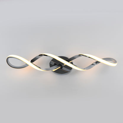 The Artika Swirl modern LED bathroom vanity light features two intertwined, wave-like metal arms with integrated LEDs, mounted on a circular base against a plain light gray background.