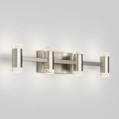 The Artika Mist modern LED bathroom vanity light 5 CCT features four cylindrical lights with frosted ends and a brushed nickel finish, mounted on a rectangular backplate against a plain light gray wall.