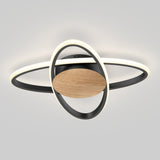 A modern ceiling light fixture with circular LED rings, a black frame, and a central wooden accent, resembling the planet Saturn with its rings, mounted on a white ceiling.