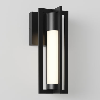 The Artika Walt indoor-outdoor LED wall light features geometric rectangular metal framing and a cylindrical white frosted glass shade, creating a sleek, contemporary look when mounted on any plain white wall.